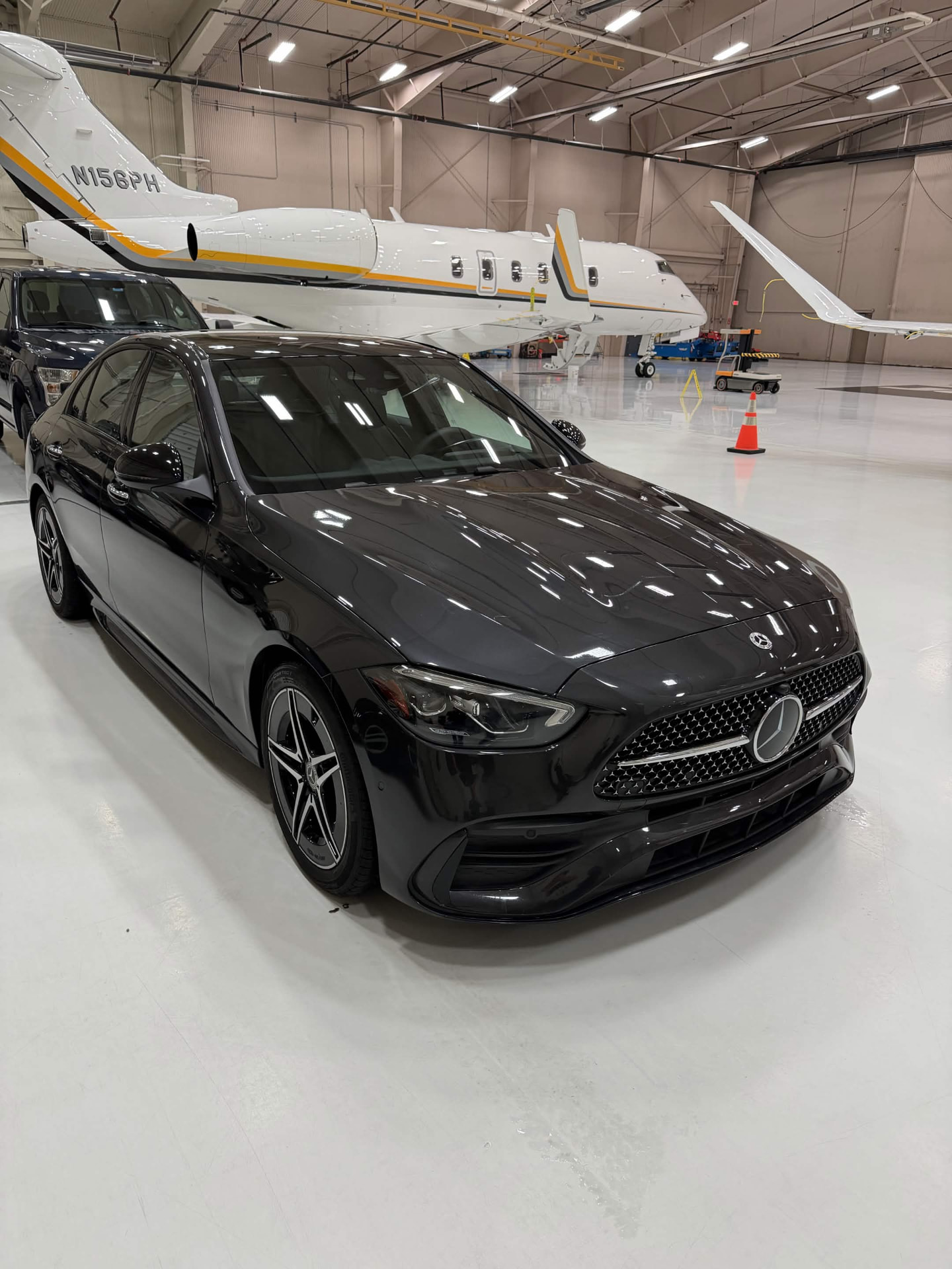 Charcoal Mercedes-Benz C-Class with crisp, swirl-free reflections across the bodywork.